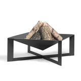 Modern black metal fire pit with logs on a white background