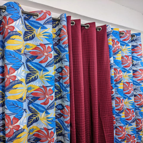 Colorful floral-patterned curtains with a plain background
